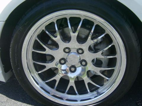 2007 Ford Mustang - Close-up of a chrome alloy wheel and tire on a vehicle.
