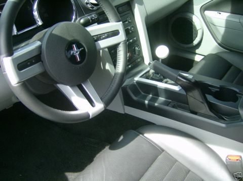 2007 Ford Mustang - Interior view of a 2007 Ford Mustang, highlighting the steering wheel and shifter.