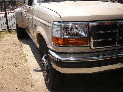 1992 Ford F-350 - Front quarter view of a tan dually truck, consistent with a 1992 Ford F-350.