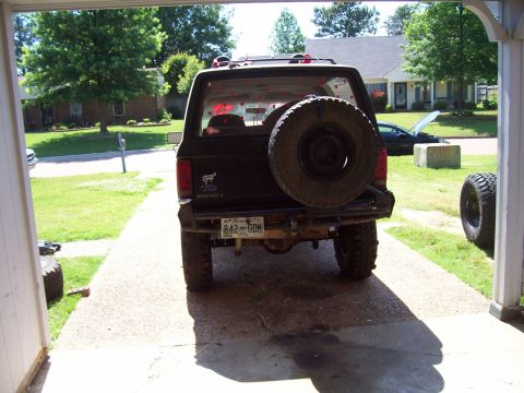 1989 Ford Bronco II - This black 1989 Ford Bronco II is viewed from the rear, a spare tire mounted on the tailgate.