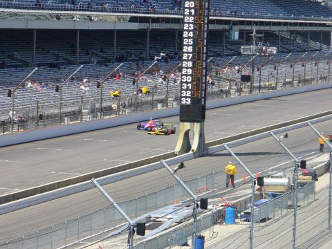 1991 Ford Probe - IndyCars compete on a race track, with a large scoring tower visible in the background.