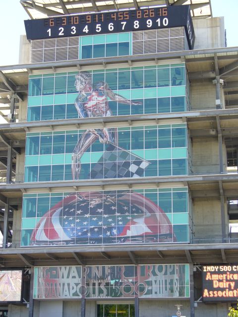 1991 Ford Probe - The Indianapolis Motor Speedway features large murals and a digital scoreboard on its building facade.