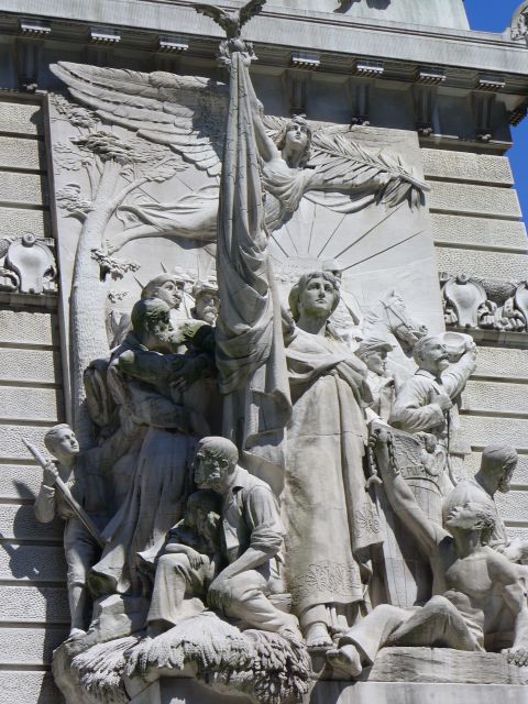 1991 Ford Probe - This stone relief depicts a group of figures gathered around a flag, symbolizing a historical or allegorical scene.