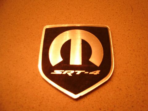 1996 Ford Probe - Close-up of a Mopar SRT-4 emblem, indicating a performance variant.