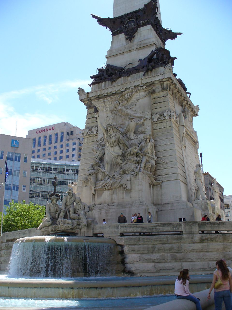 Monument with fountain in front of Conrad hotel