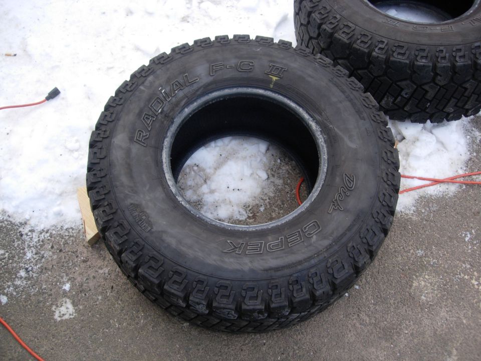 Two off-road tires, one in focus, with "RADIAL F-C II" and "DICK CEPEK" visible on sidewalls