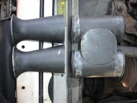 1992 Ford F-350 - Close-up view of engine intake pipes and a T-junction assembly.