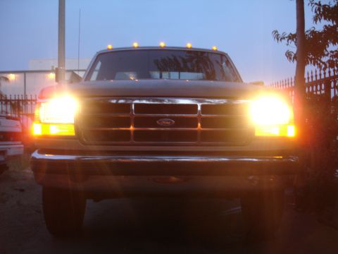 1992 Ford F-350 - Front view of a 1992 Ford F-350 pickup truck, illuminated by its headlights.