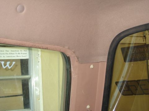1995 Ford Bronco - View of the interior headliner and window trim, with visible text on the glass.