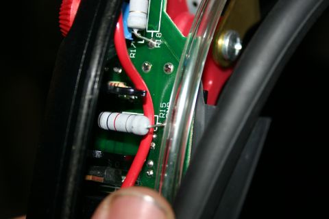 2003 Jeep TJ - A detailed view of electronic components, including resistors and wiring on a green circuit board.