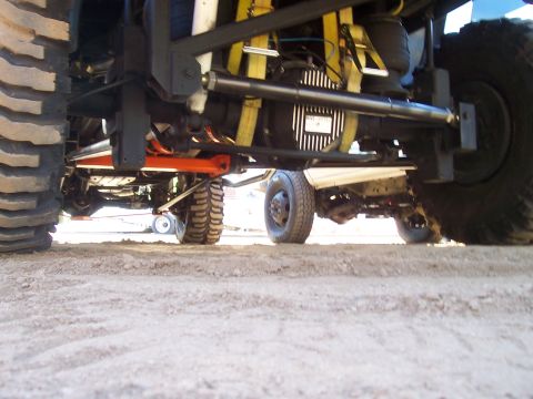 1994 Ford F-150 - Close-up view of a truck's undercarriage, focusing on the rear axle and suspension system.