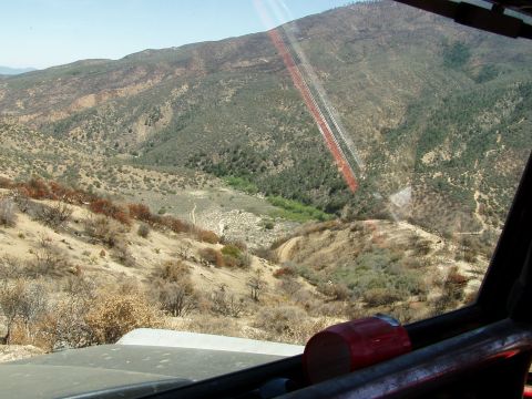 1967 Ford Bronco - View from inside an off-road vehicle as it navigates a , mountainous terrain.