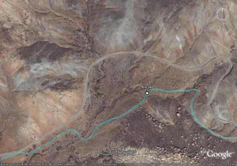 1992 Ford Explorer - This satellite image shows a remote desert area with a road and a river, labeled as 'Rm 390'.