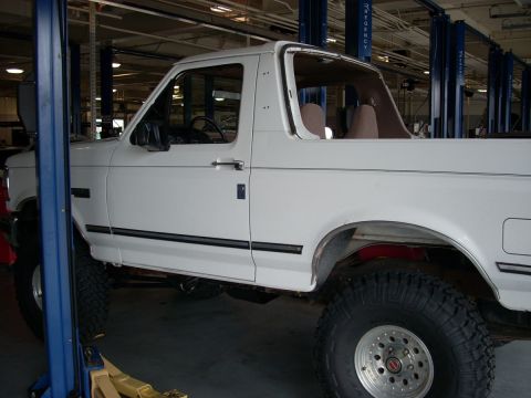 1992 Ford Bronco - This 1992 Ford Bronco is shown in a repair shop, lifted for service.