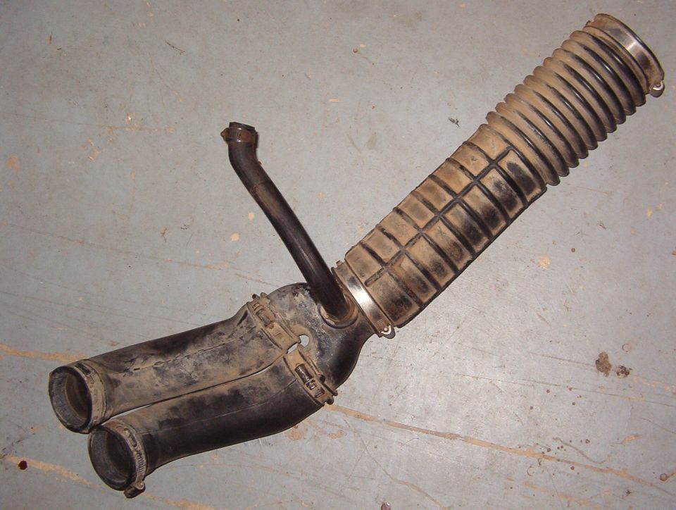 Used air intake duct and resonator assembly on concrete floor