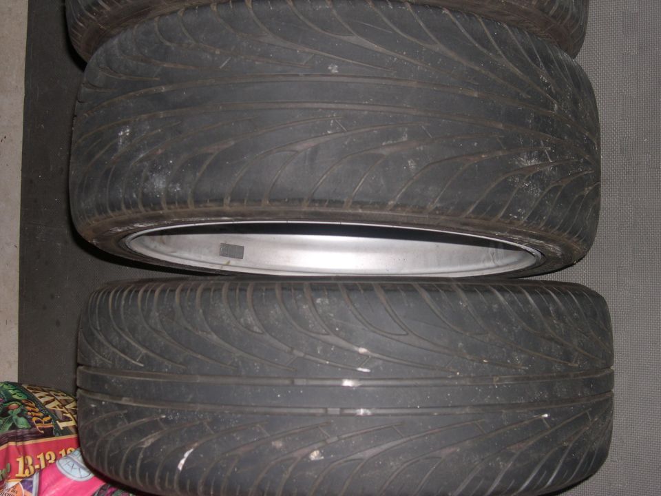 stack of two tires with silver rims