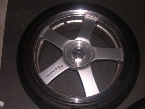 1997 Ford Probe - A silver five-spoke wheel with 'RH Evolution' text is shown, likely an aftermarket part.