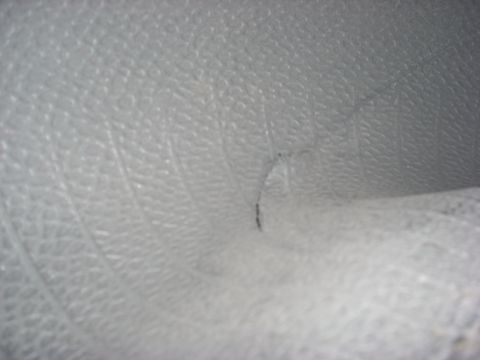 2000 Chevrolet Tahoe - Detail of interior upholstery texture, showing a small dark mark.