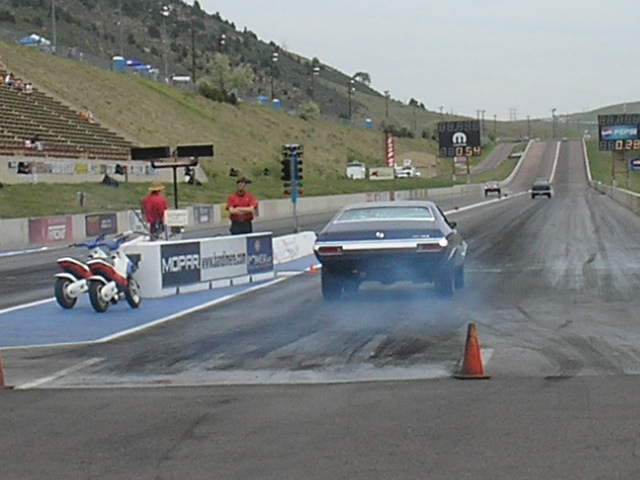 1972 Ford Torino Sport Fastback doing a burnout at a drag strip
