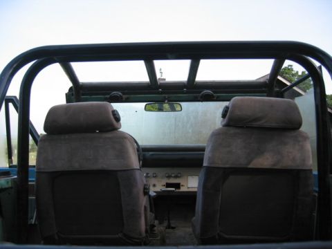 1968 Ford Bronco - The interior of a 1968 Ford Bronco is visible, the front seats and dashboard area.