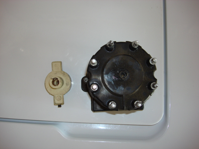 we wer driving down the street and had a real bad shake and then the motor died. one issue was the cap and rotor ( i should have replaced at the time i did plugs and wires but i was too cheap. the rotor was burned and the coil connector was blown off the cap. you can see a hole where it should be.