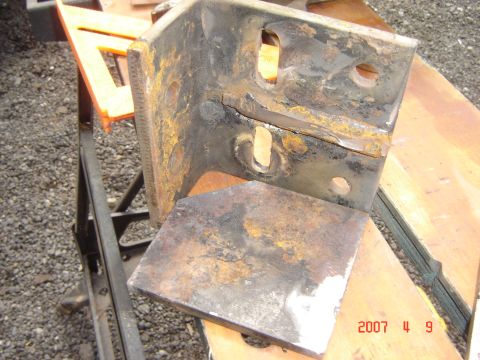 1993 Ford Bronco - This heavily rusted metal bracket, likely a vehicle part, is shown on a workbench. The date 2007 11 9 is visible in the lower right corner.
