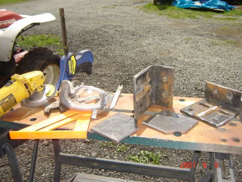 1993 Ford Bronco - Metal fabrication project with tools and parts laid out on a workbench.