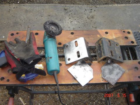 1993 Ford Bronco - Tools and metal parts laid out on a workbench, ready for fabrication or repair.