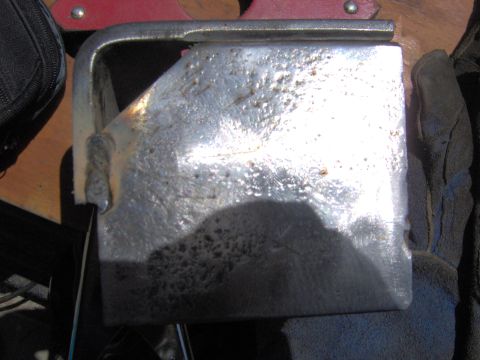 1993 Ford Bronco - A close-up view of a weathered metal component, showing signs of wear and repair.