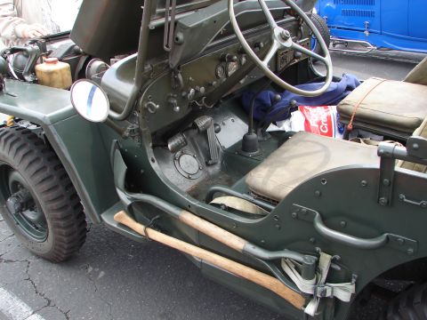 1992 Ford Taurus - The interior of a vintage military jeep shows its utilitarian design, complete with mounted tools.