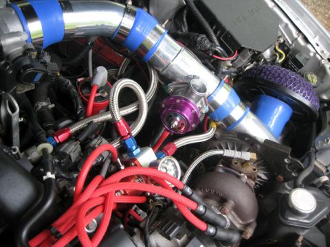 1993 Ford Probe - Aftermarket turbocharger and engine components are visible in this engine bay.