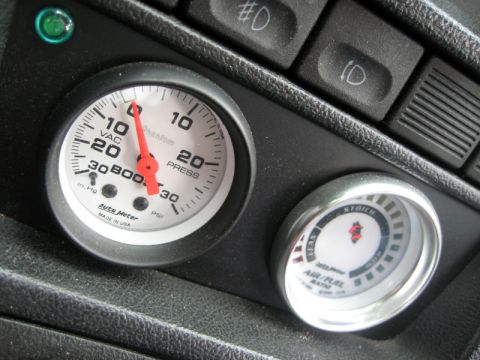 1993 Ford Probe - Dashboard gauges, including a vacuum/boost gauge and an air/fuel ratio gauge, are visible.