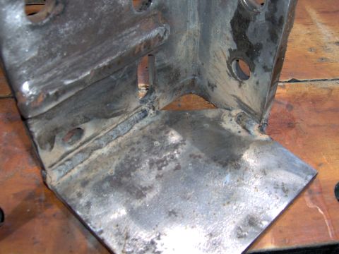 1993 Ford Bronco - Close-up of a welded metal bracket, likely a vehicle part.