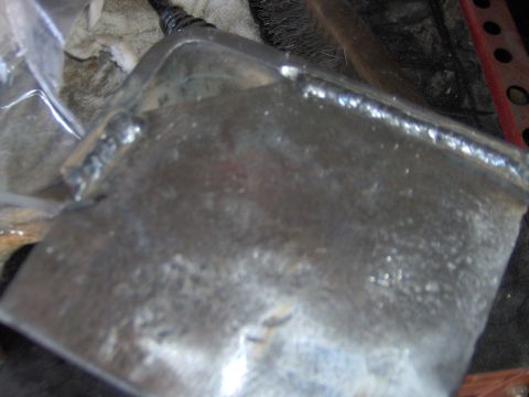 1993 Ford Bronco - Close-up of a welded metal component, the Supermotors.net watermark.