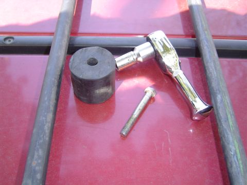 1996 Ford Explorer - Tools and parts laid out on a car's roof, suggesting a repair or modification is underway.