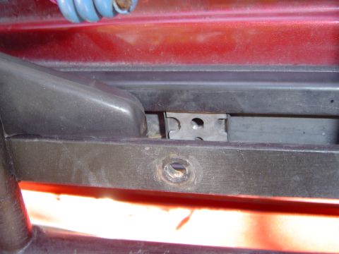 1996 Ford Explorer - Detail of a vehicle's exterior trim and mounting hardware.