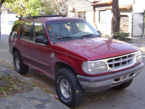 1996 Ford Explorer - This 1996 Ford Explorer is equipped with a roof rack and off-road tires, suggesting it is ready for adventure.