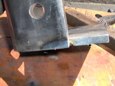 1993 Ford Bronco - A metal bracket, possibly for a vehicle, is shown in close-up detail.