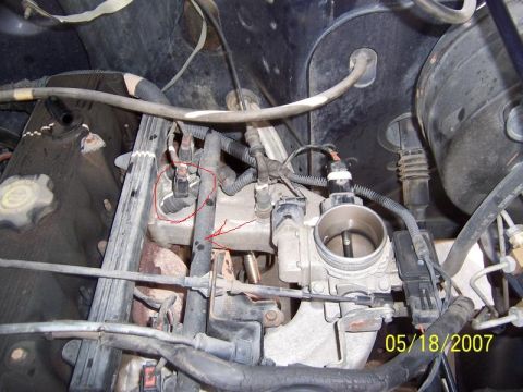 2004 Jeep Wrangler - Close-up view of an engine bay, showing the throttle body, various sensors, and associated wiring. The image is dated May 18, 2007.
