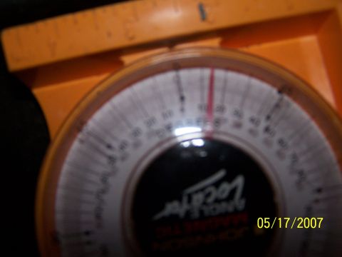 1979 Ford F-150 - Close-up of a magnetic angle locator gauge with visible markings and a date stamp.