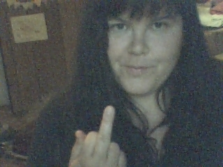 1986 Ford Bronco - A person is captured in a photo, giving the middle finger, with a SuperMotors.net watermark visible.