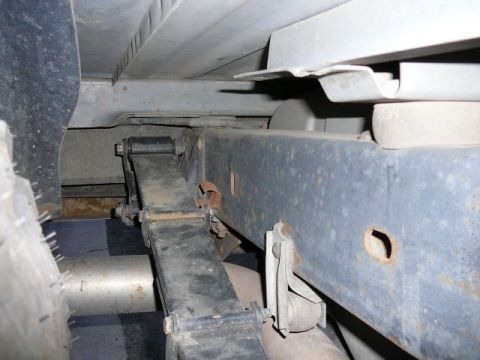 1988 Ford Bronco - Close-up view of the undercarriage, focusing on the leaf spring and frame components.