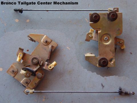 1983 Ford Bronco - Center mechanism front & back. Ford calls it the "remote control". The rubber grommet for the handle operating rod is slid onto t…