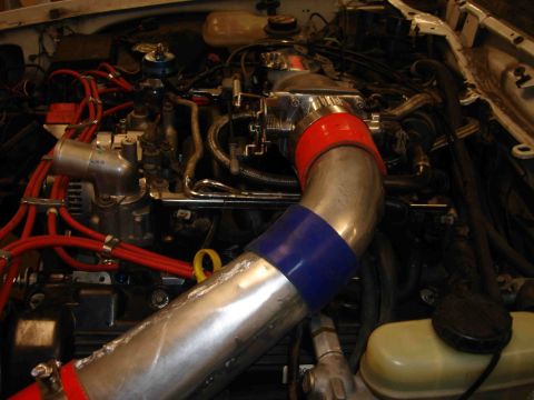 1997 Lincoln Town Car - Close-up view of an engine bay, focusing on the intake system and associated wiring.