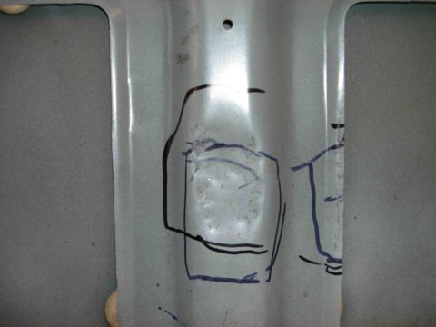 1997 Lincoln Town Car - A close-up view of a metal surface with hand-drawn markings, suggesting a specific area of interest or modification.
