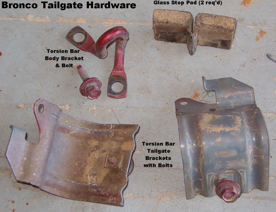 Bronco tailgate torsion-bar brackets and glass stop pads