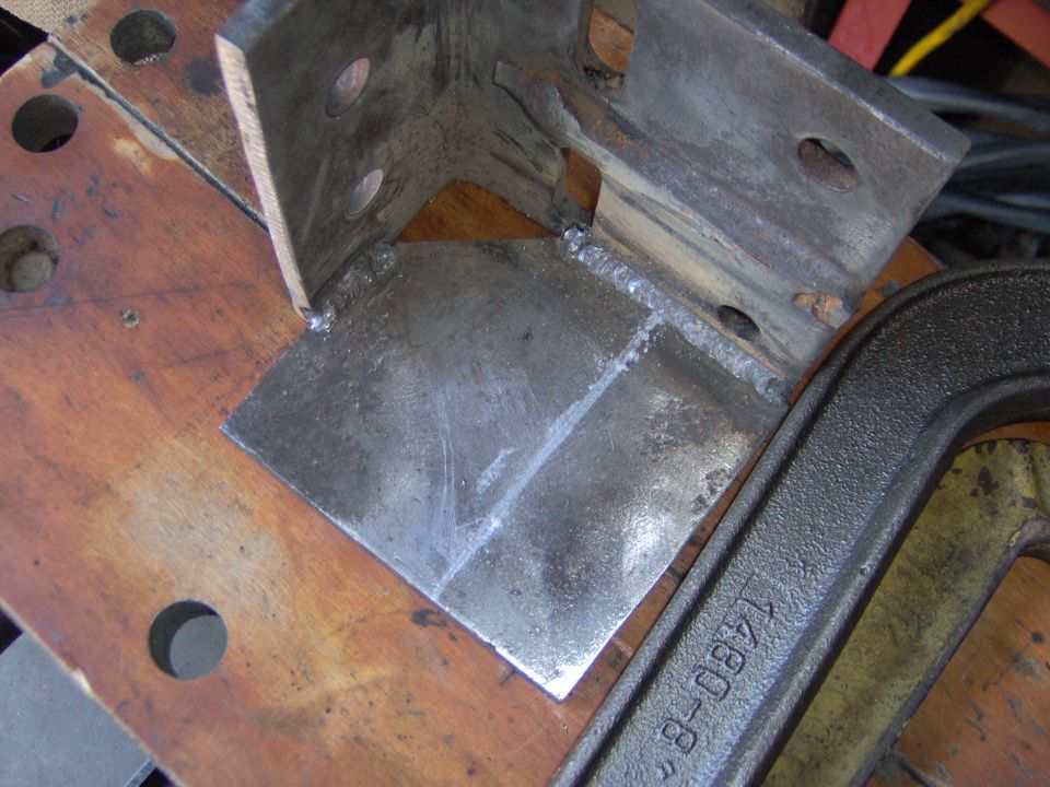 Welded metal bracket with "1480-8" stamped on clamp