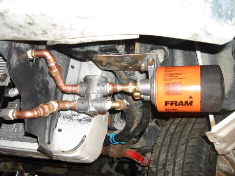 1997 Lincoln Town Car - Custom remote oil filter installation with copper plumbing and a FRAM filter.