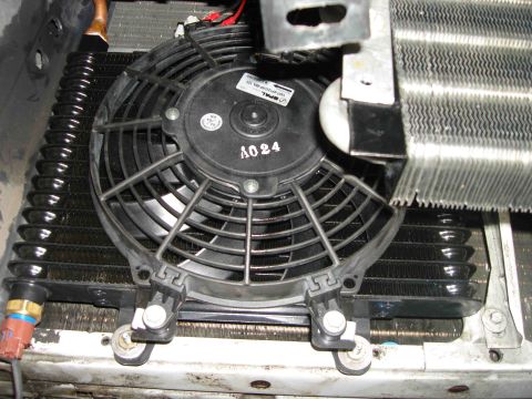 1997 Lincoln Town Car - Close-up view of a transmission cooler assembly, a fan and visible identification number A024.