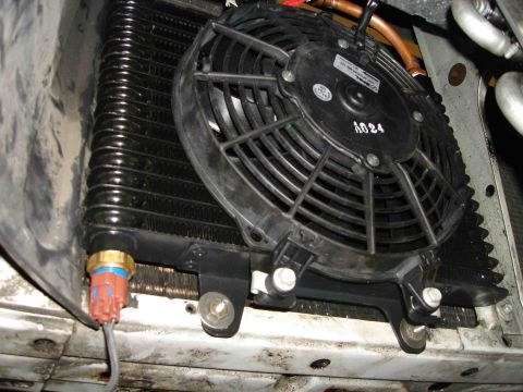 1997 Lincoln Town Car - Close-up of a transmission cooler assembly, showing the fan and a temperature sensor.